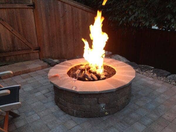 Professional landscape photography of completed residential project in Greater Seattle for article on Your Outdoor Experience with Natural Stone Fire Pits