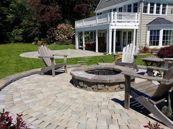Fire pit seating area in residential backyard by Classic Landscaping in Greater Seattle