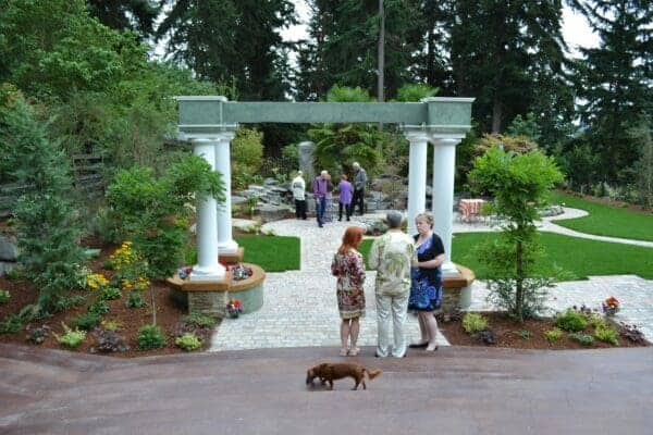 Stone patio outdoor living area in residential landscape by Classic Landscaping in Greater Seattle