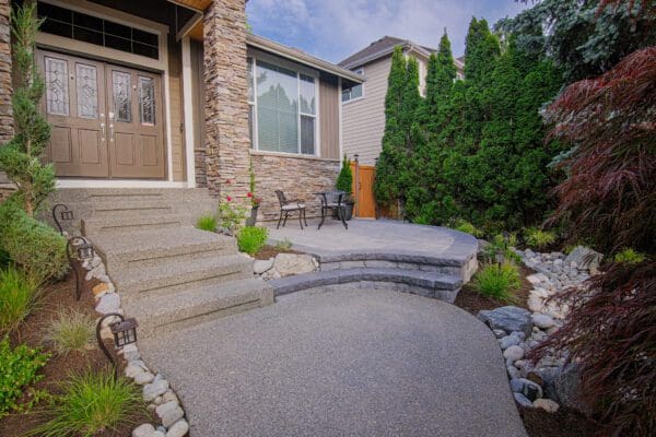 Backyard landscape combining recreational play area with ornamental garden plantings in Redmond WA by Classic Landscaping