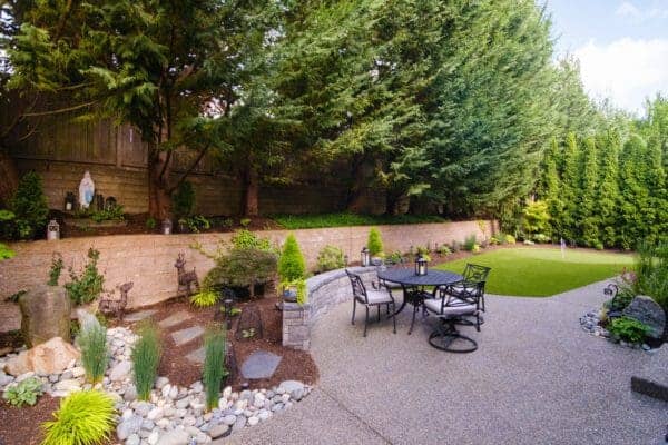 Recreational Space featuring patio design and plantings by Classic Landscaping
