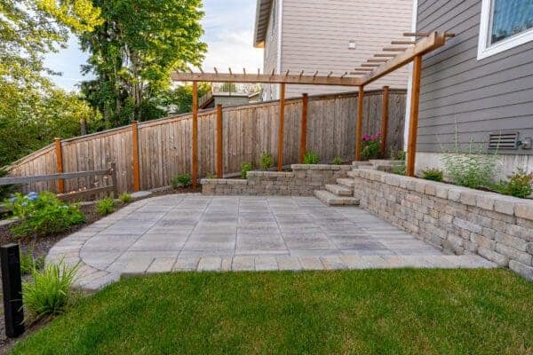 Mature ornamental plantings and evergreen screening in Kenmore residential landscape design by Classic Landscaping