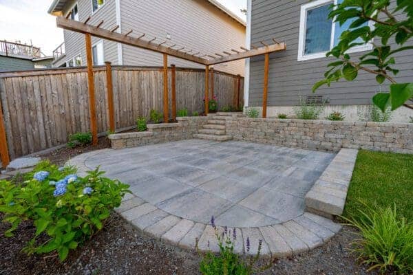 Custom stone garden stairs with integrated lighting connecting landscape levels in Kenmore WA project