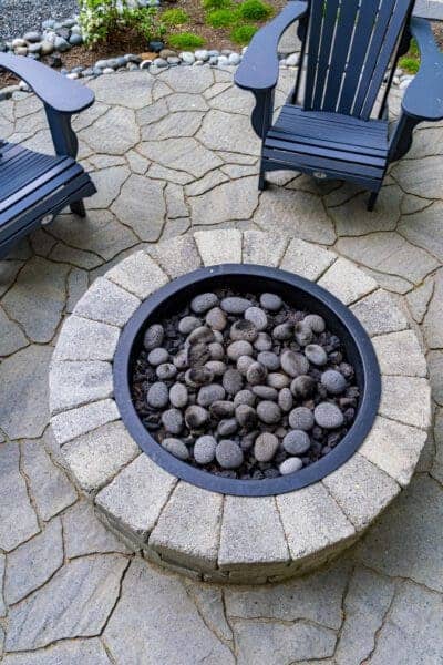 Residential residential landscape project detail showing river rock borders by Classic Landscaping