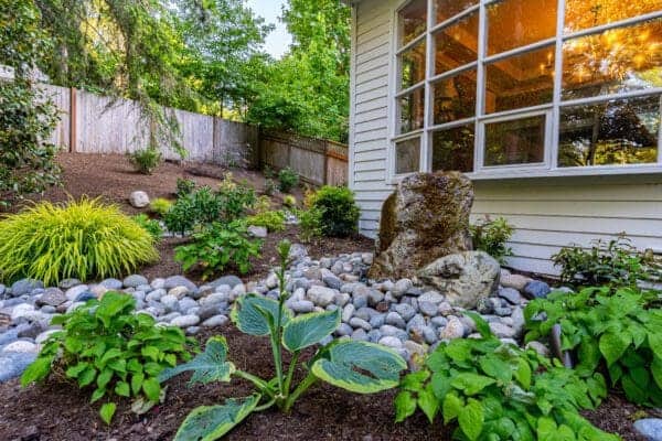 Residential residential landscape project detail showing green lawn by Classic Landscaping