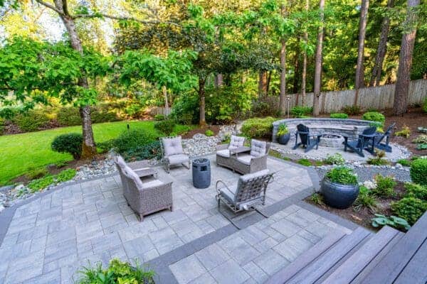 Residential residential landscape project detail showing natural stone fire pit by Classic Landscaping