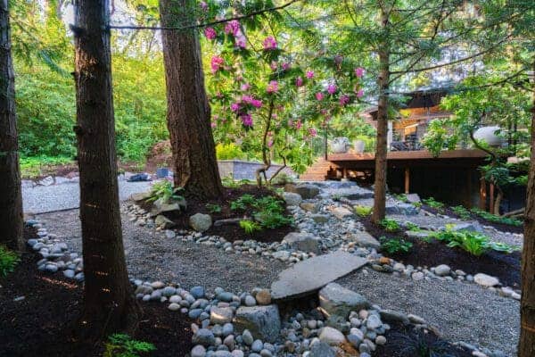 Concrete stepping stones in a Seattle-area residential landscape for article on Landscape Design Ideas for a Sloped Yard
