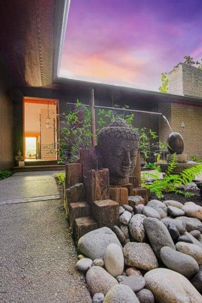 Tranquil zen garden oasis with stone features by Classic Landscaping in West Seattle
