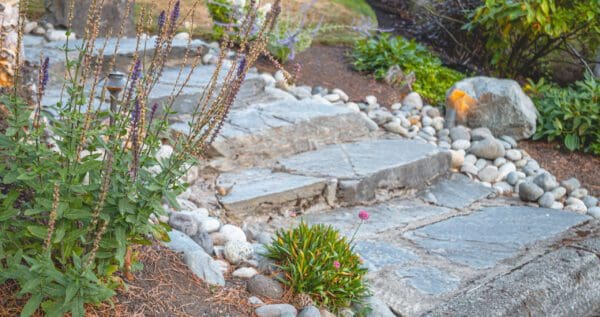 Lakeview residential landscape design with terraced garden beds and water views in Greater Seattle by Classic Landscaping