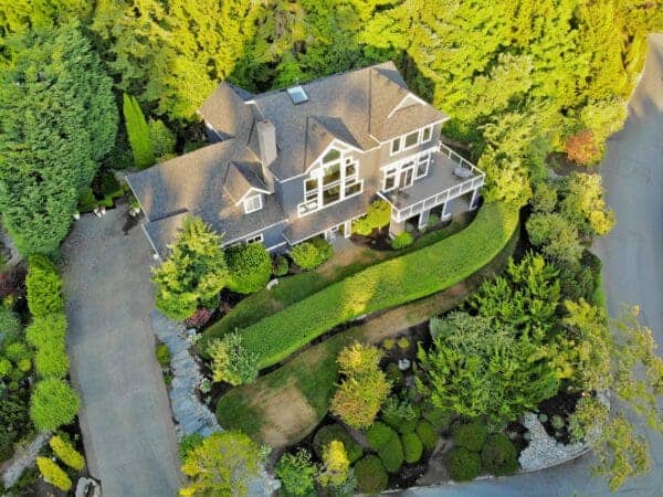 Formal garden border with boxwood hedging and layered perennial plantings in Greater Seattle lakeview landscape