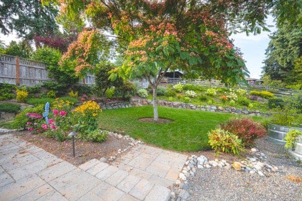 Professional outdoor entertainment space with integrated garden design in Greater Seattle by Classic Landscaping