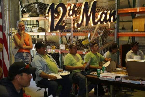 Classic Landscaping crew members collaborating during field training
