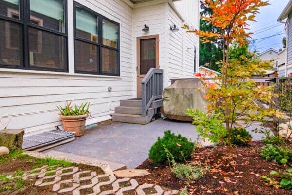 Landscape Makeover featuring water views and natural plantings by Classic Landscaping