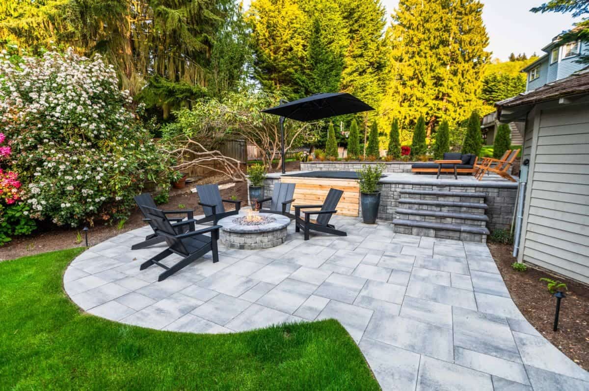 Terraced garden levels with stone retaining walls and native plantings in Shoreline WA landscape design project